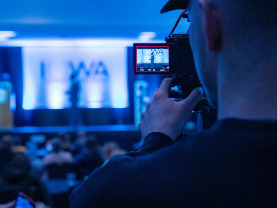 Capturing a conference event with a focus on professional videography services.